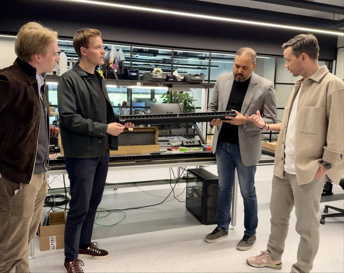 RunwayVC and the Muybridge team examining an early sensor array bar in the Muybridge lab