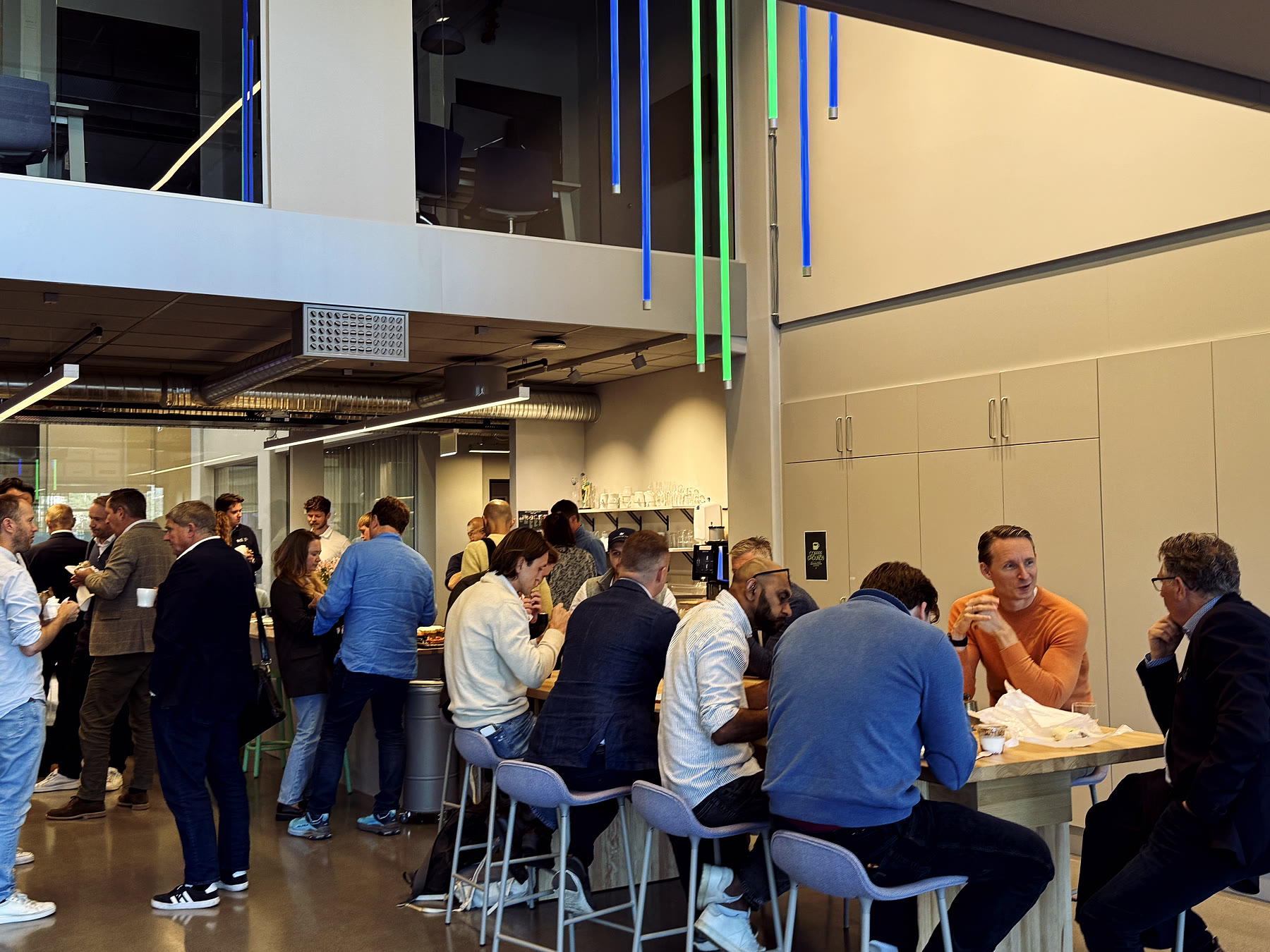 Attendees from research, industry and investment continuing the conversation over lunch in the Runway Tech Hub.